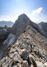 Mountaineer on a narrow ridge