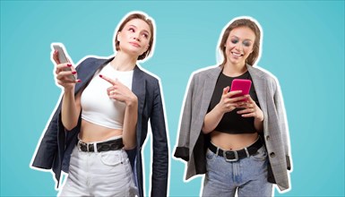 Portrait of two beautiful girls with mobile phones. Friendship concept in social networks.