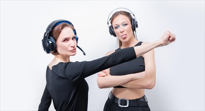 Image of two funny women with headsets. Customer support concept.