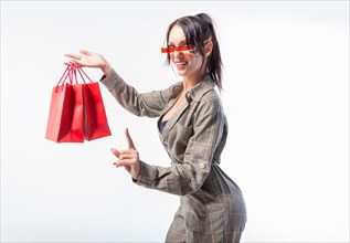 Business woman with red shopping bags. White background. Holiday shopping concept.
