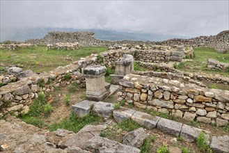 Remains of the Illyrian hilltop settlement of Byllis and view of the VJosa valley