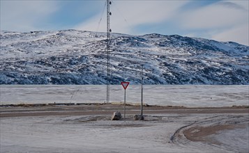 Traffic sign Give way on the main road in Kangerlussuaq