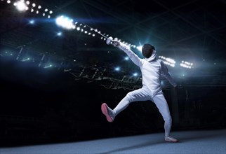 The fencer moves forward with a sword in his hand. Sport concept.