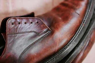 Brown men's shoes made of genuine leather close-up