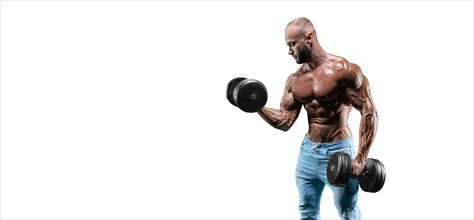 The athlete performs an exercise in the gym with dumbbells on a white background. Fitness