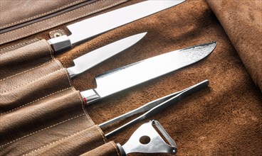 Set of professional cook tools. Special case of cook knives. View from above