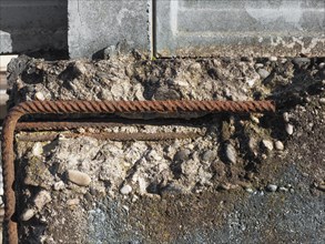 Damaged reinforced concrete with exposed rebar