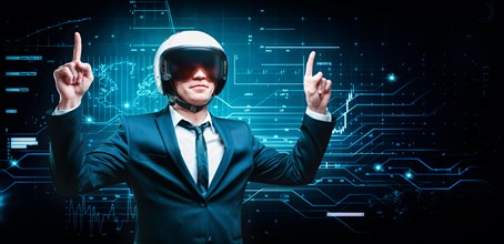 Portrait of a man in a suit and helmet. He shows thumbs up on the background of a futuristic hologram. Business concept. IT.