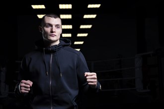 Young kickboxer posing in the studio. The concept of martial arts