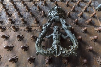 Historic door knocker at the gate of the Palazzo Ducale