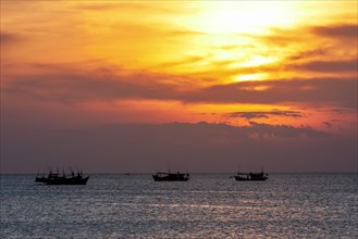Sunset and fishing boats