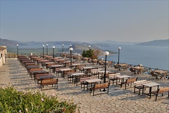 Restaurant terrace above Qeparo with views of the Ionian Sea and Corfu