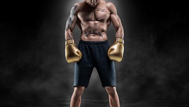 Professional Thai boxer stands in full combat gear. Muay Thai