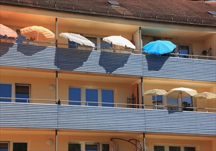 Terraced houses with balconies and parasols in Nuremberg