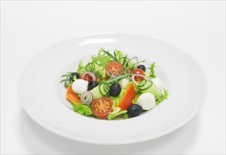 Classic greek salad. Top view. White background. Healthy eating concept.
