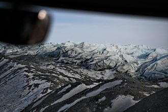 View through the windscreen of a bus onto the edge of the ice sheet north-east of Kangerlussuaq