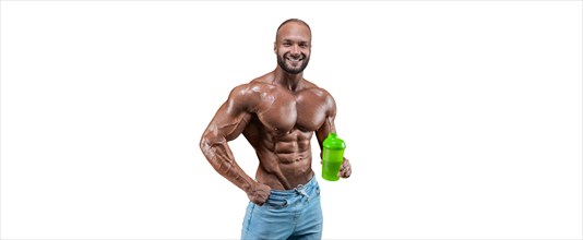 Athlete posing with a shaker in his hand on a white background. Fitness