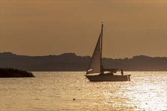 Sailing boat on Lake Chiemsee at sunset