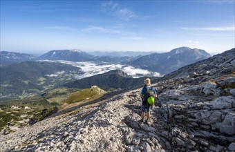 Mountaineer on hiking trail to Watzmann Hocheck summit