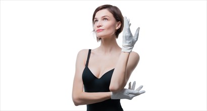 Portrait of a beautiful woman in a black dress and white gloves. Jewelry store concept. Sales consultant.