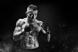 Mixed Martial Arts fighter posing on a metal grid background. Concept of mma