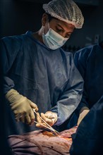 Latin doctor in surgery in operating room. Hospital surgery. Surgery