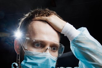 Surgeon is worried and worried in nervous tension