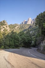 Corsican mountain road with rock massif in the background