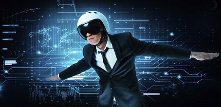 Portrait of a man in a suit and helmet. He shows that he is flying against the background of a futuristic hologram. Business concept. Internet technologies.