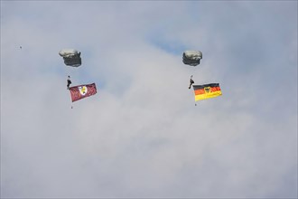 Bundeswehr parachutist with German flag. Spotterday for the Day of the German Armed Forces at Bueckeburg Army Airfield