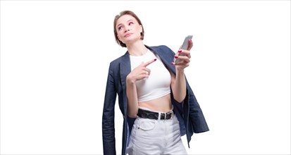 Portrait of a beautiful girl in a jacket with a mobile phone in hand. White background.