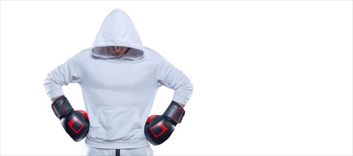 Male trainer posing in the studio with boxing gloves. White hoodie. Mixed martial arts concept. High image quality