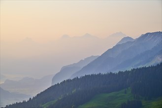 Sunrise over a misty mountain landscape with Eiger
