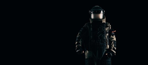 Minesweeper in an armored suit. The concept of anti-terrorism. Black background.