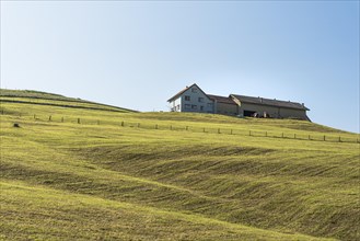 Typical Appenzell farmhouse on a hill