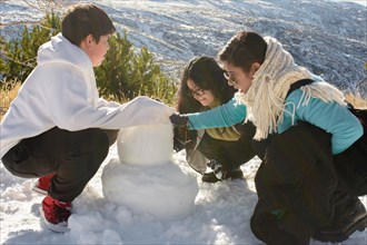 Snowy Escapades A Heartwarming Latino Family Building Snowman Memories in Sierra Nevada