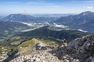 Mountaineer on steep hiking trail to Watzmann Hocheck summit