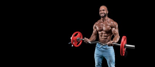 Isolated muscular man on a black background. Bodybuilding and fitness concept. Panorama.