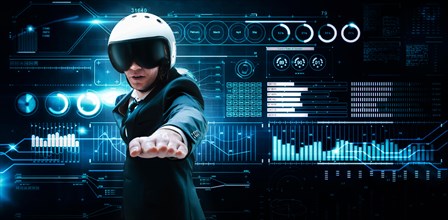 Portrait of a man in a suit and helmet. He shows that he is flying against the background of a futuristic hologram. Business concept. Internet technologies.