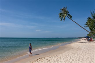 Woman walking on the beach of Phu Quoc