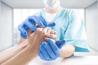 The doctor protects the patient's hand with his own hands. Medical concept. Insurance.