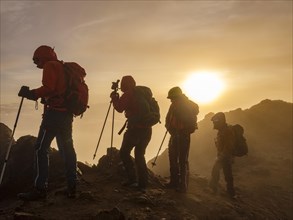 Mountaineers in the fog at sunrise on Iliniza North