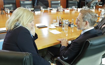 Federal Minister of Finance Christian Lindner in conversation with Federal Minister of the Interior Nancy Faeser at the start of the cabinet meeting.cabinet meeting