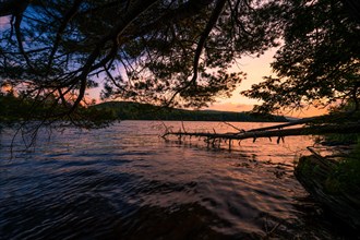 Summer Solstice Sunset on a lake in Catskills Mountains
