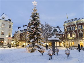 Christmas tree in snow on the square in Ystad