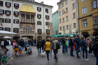 Tourists in front of the Golden Roof in the historic centre of Innsbruck
