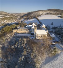 Aerial view of castle and church in winter