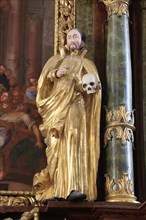 Baroque figure of a saint with skull