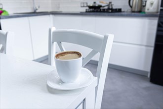 Cup of morning americano on white modern minimalist kitchen