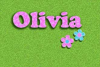 The name Olivia written with pink